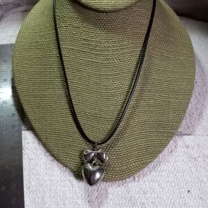 Silvertone heart bow pendant on black cord necklace